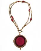 Our large round intaglio in Ruby surrounded with seed pearls on a mix of bead and chain. This necklace can be worn short and toggled at the front 16" or a single strand long at 32". 