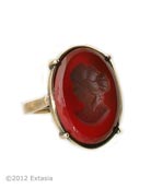 From our Ring Collections, a great ring in our hand pressed opaque Wine German glass intaglio. Medium to large ring. Sizes 7, 8, and 9. Ring measures just over an inch in length. Bronze. Each ring is made to order in the USA. 