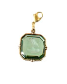 From our Charm du Jour Collection, a transparent Tourmaline German glass intaglio charm. The medium 3/4 inch wide charm comes with a lobster closure to attach to your own chain, or to one of ours, available from this website. Each charm made to order in the U.S.A. 